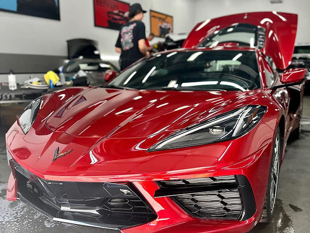 Glossy red sports car after ceramic coating by Apogee Mobile Detailing